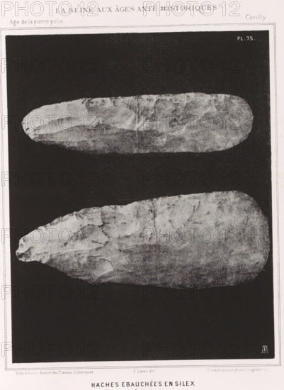 HACHES EBAUCHÉES EN SILEX 1, 1 nature, Flint axes, page, photomechanical print, number: 'Pl. 75', monogram: 'LEL', inscription: 'Ville de Paris. Atelier des Travaux historiques. E. Lacan, dir. Procédé spécial photo-lithographique.', France, cliché maker: Ville de Paris Atelier des Travaux historiques, Paris, publisher: Imprimerie Impériale, supervision: Ernest Lacan, c. 1860 - in or before 1869, photographer, paper, photolithography, height 240 mm x width 190 mm, For location of print in book: see number under 'Inscriptions, Brands'., animals (skeleton of an animal), palaeontology, A vertical grayscale image showing two elongated, roughly oval stone objects placed one above the other against a dark background, each with irregular, textured surfaces and worn edges; a narrow light border surrounds the dark area and a thin margin frames the whole image.