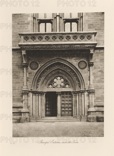 Main entrance to the University of Glasgow, Principal Entrance under the Tower, page, photomechanical print, inscription: 'No.23', cliché maker: T. & R. Annan & Sons, Glasgow, c. 1886 - in or before 1891, photographer, paper, photoaquatint, height 194 mm x width 142 mm, Print on twelfth unnumbered page after page xxxiii., gate, entrance, university (building, education, tuition), A stone entrance with ornate carved arches frames a pair of tall wooden doors, one of which is slightly ajar, each door panel featuring a grid of raised square designs; above the doorway a pointed arch contains layered concentric molding and a circular window with petal-shaped panes, flanked by decorative stonework and slender columns with carved capitals; a horizontal stone balustrade with circular floral motifs sits above a projecting cornice supported by corbels, and round recessed panels appear on the wall on either side of the arch; steps lead up to the entrance and the surrounding facade is composed of s...
