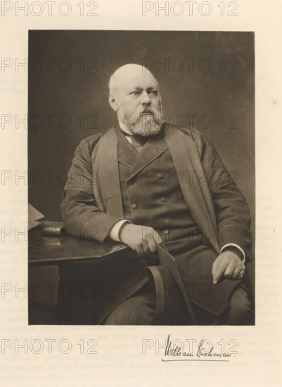 William Leishman, Portrait of William Leishman, page, photomechanical print, cliché maker: T. & R. Annan & Sons, Glasgow, c. 1886 - in or before 1891, photographer, paper, photoaquatint, height 189 mm x width 146 mm, Print on fifth unnumbered page after page 116., Person, historical persons, professor, midwife, 'accoucheuse', A sepia-toned portrait of a seated older man with a full beard and balding head wearing a dark three-piece suit and an overcoat, his left arm resting on a table beside a stack of books and his right hand holding the arm of the chair, the background a dark plain rectangle set against a lighter border.