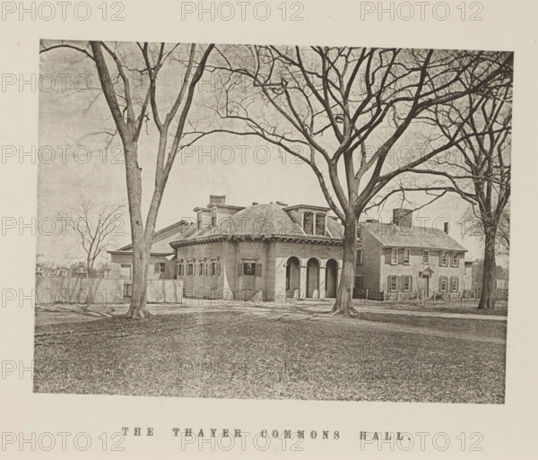 The Thayer Commons Hall, View of the Thayer Commons Hall of Harvard University, page, photomechanical print, c. 1870 - in or before 1875, paper, collotype, photoprint, height 156 mm x width 208 mm, university building, college, North America, Massachusetts, Cambridge (MA), Harvard College, A sepia-toned photograph showing a large house with a rounded central section featuring arched openings and shuttered windows, flanked by rectangular wings with multiple windows and a chimney; several tall leafless trees stand in front of the building, their bare branches extending across the sky and casting shadows on the ground, and a low fence runs beside one wing while a grassy lawn fills the foreground.