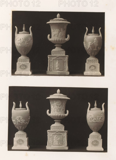 Six decorated vases and bases, photograph, page, photographer: Joseph Cundall, c. 1868 - in or before 1873, paper, carbon print, height 361 mm x width 270 mm, pedestal of a piece of sculpture (perhaps in the form of a herm), container of ceramics: jar, jug, pot, vase, sculpture (relief, sculpture), A monochrome photograph showing two rows of three ornate urns each against a dark rectangular backdrop with a light border, each urn set on a square plinth; the urns feature flared handles, domed lids, and relief decorations depicting human and animal figures and decorative motifs, with central larger urns having more elaborate bases and finials, and side urns presenting rounded bodies with raised scenes and patterned pedestal panels, all arranged symmetrically within the framed dark background.