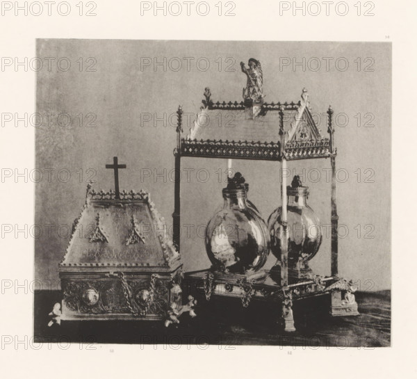 Two gilded silver chrismatories, displayed at an exhibition of religious objects from the Middle Ages and Renaissance in 1864 in Mechelen, page, photomechanical print, number: '52 u 53', number: '53 - 52', number: '-38', photographer: Joseph Maes, Mechelen, clichémaker: Simonau & Toovey, Antwerp, 1864 - in or before 1866, paper, photolithography, height 154 mm x width 180 mm, oil used in the church, vessels and utensils used in the church, Period, 1864, A grayscale photograph showing ornate metal objects arranged against a plain background, including a decorated box with a peaked lid topped by a simple cross and intricate surface patterns, a raised canopy structure with a decorative roof supported by slender columns, and a pair of rounded, reflective vessels mounted on square bases beneath the canopy; the objects feature ornamental finials, chains, embossed medallions, and sculpted corner supports, and a small statuette stands atop the canopy roof.