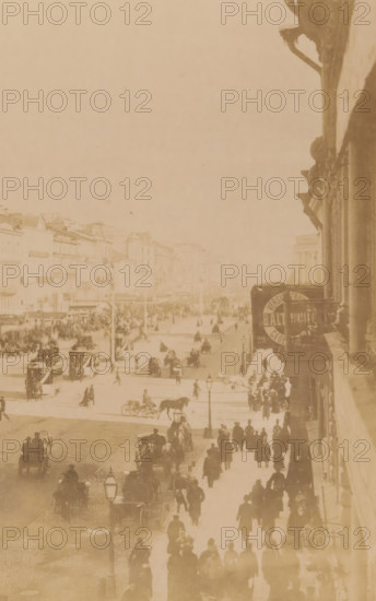 The Nevsky Perspective, View of Nevsky Prospekt in Saint Petersburg, Russia, Saint-Pétersbourg, photograph, page, Saint Petersburg, 1890-06 - 1890-07, photographer, Leningradskaya, paper, albumen print, height 164 mm x width 222 mm, street, Nevsky Prospekt, A faded rectangular photograph mounted on aged paper with decorative printed borders, showing an upside-down sepia street scene with people, horse-drawn carriages, and buildings, framed by a thin red inner line and ornate brown corner embellishments, with scattered spots and discoloration on the surrounding beige background.