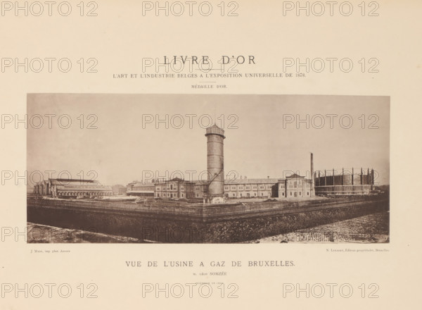 View of the gas factory in Brussels, Vue de l'usine a gaz de Bruxelles, page, photomechanical print, inscription: 'Livre d'or, L'art et l'industrie Belges a l'exposition universelle de 1878.', creator: Joseph Maes, Antwerp, publisher: N. Lenaert, Brussels, c. 1874 - in or before 1879, Joseph Maes, N. Lenaert, publisher, paper, collotype, photoprint, height 110 mm x width 266 mm, factory in landscape, gasworks, A large sepia-toned panoramic photograph centered on an industrial complex shows a long row of brick buildings with multiple windows and varied rooflines. A tall cylindrical tower with a narrow top and exterior stair runs upward from the center foreground, accompanied by a slimmer vertical chimney to the right. To the far right a round structure with vertical supports and a low wall surrounds its base. On the left a series of connected shed-like buildings with arched openings extends along the complex. A fenced foreground area and a darker strip of ground run across the bottom of...