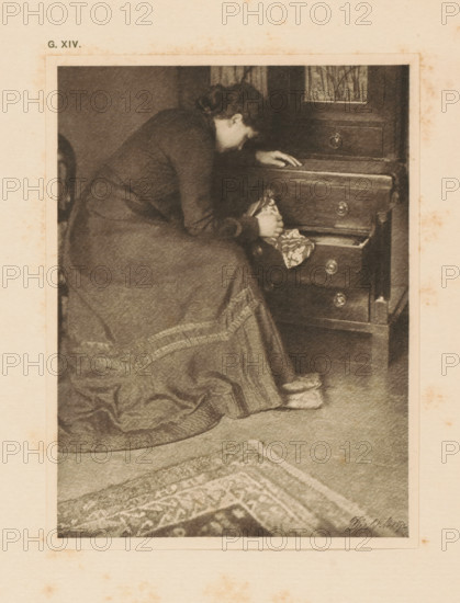 Woman at a chest of drawers, page, photomechanical print, inscription: 'G. XIV.', inscription: 'Memories by R. Rührkoop', photographer: Rudolf Dührkoop, cliché maker: anonymous, c. 1900 - in or before 1905, paper, photoaquatint, height 142 mm x width 106 mm, adult woman, wardrobe, A sepia-toned image of a woman seated beside a wooden chest of drawers, leaning forward with one hand resting on an upper drawer and the other holding a patterned piece of cloth from an open drawer; she wears a long dress with a textured hem and slippers on her feet, and a patterned rug is visible on the floor in front of her.