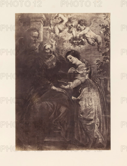 Photo reproduction of the Education of Mary by Peter Paul Rubens, photograph, reproduction, page, photographer: Edmond Fierlants, after painting by Peter Paul Rubens, publisher: C. Muquardt, Brussels, c. 1856 - in or before c. 1861, paper, albumen print, albumendruk, height 361 mm x width 250 mm, education of Mary, A sepia-toned rectangular artwork shows three human figures and two winged cherubs, with an older seated woman wearing a headscarf and dark draped clothing, a younger standing woman in a light flowing dress leaning toward the older woman and holding an open book, and a partially visible older man behind them; two cherubs hover above holding a garland of leaves, and foliage appears along the right edge, all set against an architectural and cloudy background.