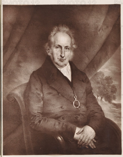Photo reproduction of a painting depicting a portrait of Oswald Leycester, reproduction, page, photomechanical print, cliché maker: Woodbury Permanent Photographic Printing Company, after painting by anonymous, c. 1866 - in or before 1876, photographer, paper, Woodburytype, height 133 mm x width 105 mm, Person, Oswald Leycester, historical persons (portraits and scenes from the life) (half-length portrait), An older man with light hair and sideburns sits in a high-backed chair wearing a dark double-breasted coat and a light-colored shirt, a pendant on a chain rests on his chest, his hands are folded in his lap holding a folded paper, a draped curtain fills the background on one side and a tree and sky appear on the other side.