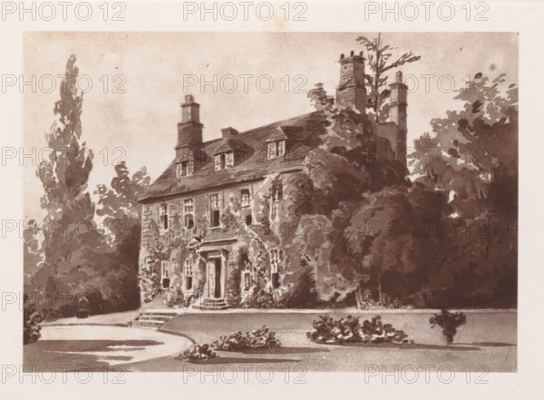Photo reproduction of a painting depicting a view of West Woodhay House in West Woodhay, reproduction, page, photomechanical print, cliché maker: Woodbury Permanent Photographic Printing Company, after painting by anonymous, c. 1866 - in or before 1876, photographer, paper, Woodburytype, Woodburytypie, height 84 mm x width 123 mm, rural housing, eg country-house, villa, cottage, façade (of house or building), West Woodhay, West Woodhay House, A sepia-toned illustration shows a large, old house with a pitched roof and multiple chimneys rising above it, dormer windows projecting from the roof, and a central doorway reached by a small set of steps; the facade is partially covered in climbing vines and flanked by dense, leafy trees and shrubs that obscure parts of the building, while a curved driveway and small planted beds occupy the foreground.