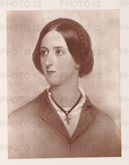 Photo reproduction of a drawing depicting a portrait of Anne Louisa Hare, reproduction, page, photomechanical print, cliché maker: Woodbury Permanent Photographic Printing Company, after drawing by Giovanni Battista Canevari, c. 1866 - in or before 1876, photographer, paper, Woodburytype, Woodburytypie, height 118 mm x width 92 mm, Person, Anne Louisa Hare, historical persons - BB - woman, A sepia-toned portrait of a young woman shown from the shoulders up, facing slightly to her left with her gaze directed upward and outward, featuring smooth dark hair styled with a braided band across the top and tucked into a low, rounded bun, a clear oval face with large eyes, a straight nose, and closed lips, wearing a high-collared lace blouse under a tailored jacket and a dark cord necklace with a small pendant in the shape of a cross, all set against a plain, softly textured background.