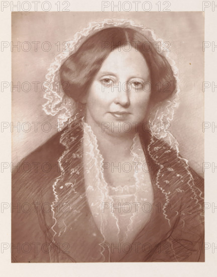 Photo reproduction of a drawing depicting a portrait of Maria Hare, reproduction, page, photomechanical print, cliché maker: Woodbury Permanent Photographic Printing Company, after drawing by Giovanni Battista Canevari, Rome, c. 1866 - in or before 1876, photographer, paper, Woodburytype, Woodburytypie, height 117 mm x width 91 mm, Drawing made in 1858., Person, Maria Leycester, historical persons - BB - woman, A sepia-toned portrait of a woman shown from the chest upward, with a centered face, straight hair parted in the middle and smoothed down on both sides, and a translucent lace veil framing her head and shoulders. Her expression is neutral with softly shaded eyes, defined eyebrows, a straight nose, and closed lips. She wears a dark outer garment with a lighter, ruffled lace collar and a layered bodice beneath, and delicate lace trim runs along the edges of her clothing. The background is plain with subtle tonal variations and the image has a narrow light border around it.