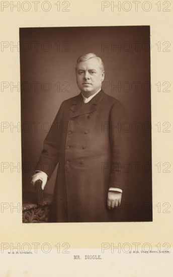 Portrait of Joseph Robert Diggle, Mr. Diggle, page, photomechanical print, inscription: '57 & 61, Elbury Street, London.', photographer: Downey, William & Daniel, London, cliché maker: anonymous, c. 1882 - in or before 1892, paper, Woodburytype, height 140 mm x width 93 mm, Person, Joseph Robert Diggle, politician, eg party leader, organization, functionaries and dignitaries in Roman Catholic church, clergy in general, A sepia-toned portrait of a middle-aged man standing and facing forward, wearing a double-breasted dark coat with a high collar and visible buttons, his left hand resting on an ornately carved surface while holding a small folded object, his right arm hanging by his side with a visible ring on a finger, short neatly combed light-colored hair, a neutral facial expression, and a plain dark background surrounded by a wide light-colored mat.