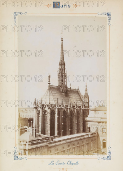 View of the Sainte-Chapelle in Paris, La Sainte-Chapelle, photograph, page, number: '639', Paris, c. 1879 - c. 1889, photographer, paper, albumen print, albumendruk, height 188 mm x width 120 mm, façade (of house or building), church (exterior) - QQ - small church, chapel, Sainte-Chapelle (Paris), A sepia-toned photograph centered on a Gothic chapel roof and spire, showing ornate stonework, pointed arches, tall narrow windows, decorative pinnacles, flying buttresses, and a slender, intricately detailed spire rising from the roof; surrounding the chapel are adjacent building rooftops with balustrades, flat roof surfaces, and rectangular windows; the image is framed by a decorative border with corner flourishes and ornamental motifs on a pale background.