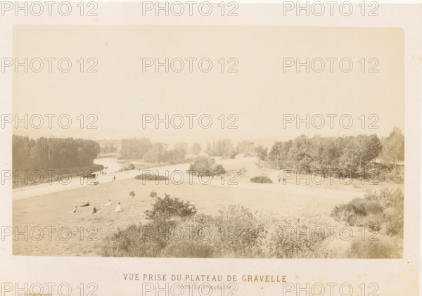 View of the Bois de Vincennes from the Plateau de Gravelle, Vue prize du Plateau de Gravelle (Côte de St. Maurice), Bois de Vincennes, photograph, page, photographer: Ildefonse Rousset, Plateau de Gravelle, c. 1861 - in or before 1866, Paris, paper, albumen print, height 128 mm x width 188 mm, public gardens, park, waterfall, A wide, pale sepia photograph showing a gently sloping grassy hill in the foreground with scattered small bushes and groups of people seated or reclining on the grass, a curving light-colored path running across the middle distance with a horse-drawn carriage and a few pedestrians, a river visible beyond the path bending through a landscape of trees and shrubs, clusters of taller trees forming darker masses on both sides, and distant hazy fields and tree lines fading into a pale sky.