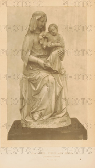 Statuette, Virgin and Child, page, photomechanical print, number: 'No. 200 '67.', inscription: 'Fourteenth Century.', London, c. 1867 - in or before 1872, paper, Woodburytype, height 166 mm x width 100 mm, sculpture, Madonna: ie Mary with the Christ-child, A monochrome photograph of a seated draped female figure wearing a head covering, holding a smaller child figure on her lap; both figures are carved with detailed folds in their garments and the child holds a small bird, the woman's hands supporting the child and resting on the drapery, the sculpture is positioned on a rectangular base with visible wear and texture, and the image is bordered by a lighter margin.