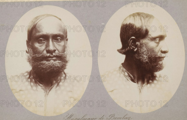 Two portraits of an unknown man from Mumbai, Musulmano di Bombay, photograph, page, photographer: Paolo Mantegazza, Mumbai, c. 1881 - in or before 1886, Maharashtra, paper, albumen print, height 151 mm x width 241 mm, adult man (side view, profile), Two oval sepia-toned portrait photographs of the same man placed side by side on a gray background, one showing his face from the front and the other in profile. The man has short, dark hair with a receding hairline and a full, curly beard and mustache with lighter streaks. His skin appears dark and textured, and his eyes look straight ahead in the frontal image and to the side in the profile. He wears a patterned garment with a collar visible at the neckline. The photographs have soft lighting and show subtle variations in tone and detail against the plain background.