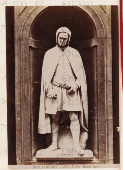 Statue of Giotto outside the Uffizi Gallery in Florence, Florence. (Uffizi) Giotto (Duprè fece), photograph, page, number: '3281', photographer: Fratelli Alinari (possibly), Florence, c. 1877 - in or before 1887, Tuscany, paper, albumen print, height 143 mm x width 101 mm, sculpture, portrait, self-portrait of painter, facade (of house or building), A monochrome photo of a statue set within a carved stone niche, showing a robed male figure wearing a hooded cloak and a tunic with detailed texture, a belt at the waist, and one hand holding a scroll while the other rests near the belt; the figure stands on a base with carved lettering, framed by arched stonework with vertical panels on either side, and the image margins show portions of a lighter border.
