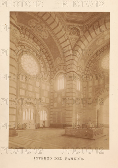 Guida del Famedio nel cimitero monumentale di Milano, book, number: '1 B 65', 1888, pasteboard, paper, printing, albumen print, height 261 mm x width 178 mm x thickness 20 mm, A sepia-toned photograph of an ornate interior space showing tall arched ceilings with striped ribbing and decorative patterns, large circular stained-glass windows set into arched frames, elaborately paneled walls with rectangular and square panels filled with decorative motifs, tall narrow arched windows with tracery, a massive central pier with horizontal banding, a raised rectangular stone or marble enclosure with carved sides on the floor, and a patterned floor beneath the architectural elements.
