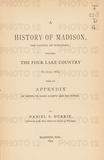 A history of Madison, the capital of Wisconsin, including the four lake country to July, 1874 : with an appendix of notes on Dane county and its town, book, name: 'WG Dooi...', writer (clerical worker): Daniel S. Durrie, writer (clerical worker), textile materials, pasteboard, paper, linen (material), albumen print, height 231 mm x width 160 mm x thickness 33 mm, A cream-colored aged book page with centered printed lines of dark serif type arranged in a title layout, featuring a large bold heading near the top, several smaller headings and subheadings stacked below it, wide margins, a light speckled paper texture, and a vertical handwritten notation in pencil along the right edge.