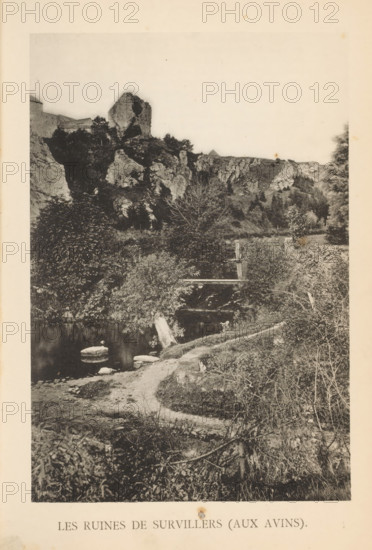 View of the ruins of Château de Survillers, Les Ruines de Survillers (aux Avins), page, photomechanical print, photographer: attributed to Victor Gaillard, Liège, cliché maker: attributed to Emile Aubry, Brussels, c. 1885 - in or before 1890, Attributed to, paper, collotype, photoprint, height 153 mm x width 104 mm, landscape with ruins, A vertical black and white photograph showing a rocky hillside with a prominent jagged rock formation near the top and dense vegetation on the slopes, a winding dirt path leading from the foreground toward the middle ground, a calm body of water with a few visible stones near its edge, scattered trees and bushes of varying sizes, a small wooden structure or bridge partially obscured by foliage spanning a narrow channel, and lighter sky above the ridge.