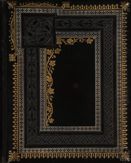 Photo album (empty), photograph album, slip-in album, Photo album with forty pages, each page featuring a passe-partout framed with gold lines for a cabinet photo., collector's mark: 'DIENST, VERSPREIDE, RIJKSKOLLEKTIES, A 856', 1860 - 1900, pasteboard, biological material, inorganic material, paper, leather, metal, color on edges, cardboard slip-in album, covered in black leather with embossed decorative edges on front and back covers, the front cover partly printed in gold and silver, four metal knobs on the back cover, incomplete metal clasp, endpapers of iridescent paper, cardboard pages with gold edges, height 216 mm x width 172 mm x thickness 58 mm x width 340 mm, A dark rectangular surface with multiple ornate borders featuring geometric and floral motifs in gold and silver tones surrounds a central solid black panel; the top left corner contains a raised circular carved medallion with swirling cutout shapes, and vertical and horizontal bands with repeating diamond and star patt...