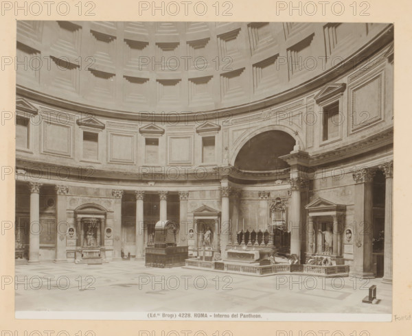 Roma - Interno del Pantheon, Interior of the Pantheon in Rome, photograph, Part of Photo album with photographs of sights and works of art in Italy., number: '4228', photographer: Edizioni Brogi, Pantheon, c. 1875 - in or before 1907, Rome, paper, gelatin silver print, height 200 mm x width 250 mm, interior of church, mausoleum, A large circular interior space with a coffered dome above and a continuous ring of rectangular recessed panels below; tall fluted columns with ornate capitals support an entablature with decorative friezes and triangular pediments above several niches; sculptural reliefs, statues in alcoves, and carved architectural details line the curved wall; an elevated altar area with balustrades and decorative furnishings sits near a semicircular arch; a freestanding structure with a curved top and a raised platform occupies the central floor area; the patterned floor shows geometric designs and the overall scene is rendered in a monochrome photographic tone.