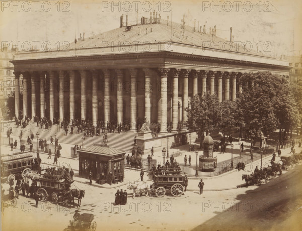Horse-drawn trams in front of Palais Brongniart, album page, photograph, This photo is part of an album., inscription: '115 Paris_ La Bourse', photographer: X phot., 1887 - 1910, paper, albumen print, height 209 mm x width 274 mm, diligence, omnibus, horse-tram, column, pillar, architecture, façade (of house or building), Paris, Palais Brongniart, A large neoclassical stone building with a wide flight of steps leading up to a portico of tall fluted columns capped by ornate capitals fills most of the scene, a seated stone sculpture on a raised pedestal positioned at the corner of the steps, a tall low roof with many small vertical pipes and vents rising above the entablature, and rows of windows and architectural details visible along the sides. Numerous people are on the steps and around the building, some standing in groups and others walking, while horse-drawn carriages and a large enclosed omnibus occupy the street in front. A fenced plaza with trees and lamp posts sits adjacent to ...