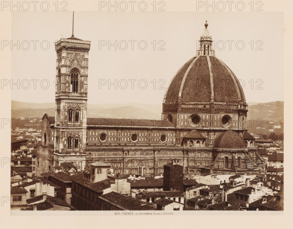 La Cattedrale de Or S. Michele, View of the Cathedral of Florence, Italy, Firenze, photograph, number: '3021.', address: 'GIACOMO BROGI, PHOTOGRAPH EDITOR, FIRENZE, LUNG ARNO DELLE GRAZIE 15', photographer: Giacomo Brogi, Florence, publisher: Edizioni Brogi, 1864 - 1881, Tuscany, pasteboard, paper, albumen print, height 345 mm x width 470 mm, church (exterior), Orsanmichele, A sepia-toned photograph showing a large ornate cathedral with a prominent domed roof and a tall decorated bell tower, both featuring patterned stonework and arched windows, set above a dense cluster of tiled-roof buildings in the foreground, with rolling hills visible in the distant background.
