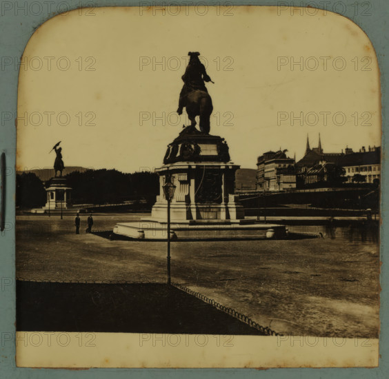 Equestrian statues of Archduke Charles and Eugene of Savoy on the Heldenplatz in Vienna, Heldenplatz in Wien, stereograph, number: '1510.', Vienna, after sculpture by Anton Dominik Fernkorn, 1900 - 1940, Anton Dominik Fernkorn, photographer, after sculpture by, Lower Austria, paper, plastic, pasteboard, organic material, cellulose nitrate film, black and white slide, height 75 mm x width 150 mm, Person, Charles V (Holy Roman Emperor and King of Spain), Eugenius of Savoy, square, circus, equestrian statue, Heldenplatz, A sepia-toned photograph showing a large equestrian statue on a stepped stone pedestal in the foreground with ornate reliefs and decorative elements, a lamppost positioned in front of the pedestal, a second equestrian statue visible further back to the left atop its own plinth, a wide open paved area surrounding the monuments with a low decorative fence edging a darker paved section, two figures standing near the base of the main pedestal, distant rows of trees and a rive...