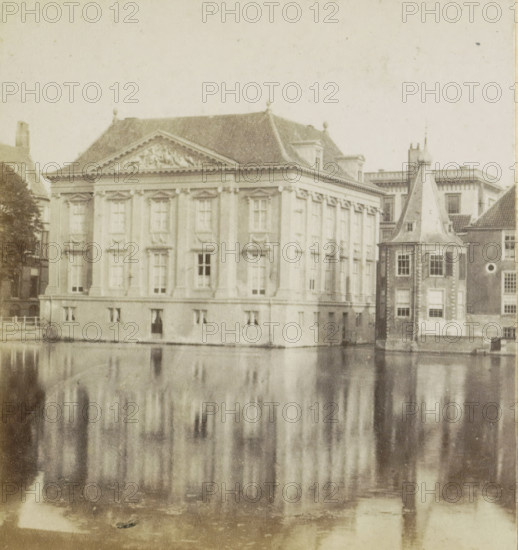 Mauritshuis The Hague, seen from the Lange Vijverberg, View of the Hofvijver and the Mauritshuis in The Hague, stereograph, inscription: '... Hollande', The Hague, 1852 - 1863, photographer, pasteboard, paper, albumen print, albumendruk, height 87 mm x width 175 mm, pond, pool, exterior, representation of a building, Mauritshuis, Lange Vijverberg, A large classical stone building with ornate window frames and decorative cornices sits beside a body of water, its multi-paned windows and pilasters visible along the façade and a triangular pediment with sculpted relief at roofline; to the right a taller narrow tower with a steep conical roof and small windows adjoins the main structure, and the lower part of the scene shows the building and tower reflected in the calm water, creating vertical blurred reflections.