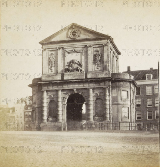 Delftschepoort Rotterdam, View of the Delftsche Poort in Rotterdam, stereograph, Rotterdam, 1873 - 1890, photographer, pasteboard, paper, albumen print, height 85 mm x width 170 mm, city-gate, Delftsche Poort, A stone archway structure with columns and ornate carvings, including decorative relief panels and sculpted figures, topped by a triangular pediment with a circular ornamental feature, flanked by adjacent buildings with windows and tiled roofs, a paved foreground leading to the arch, and a horizontal railing near the base of the building.
