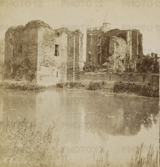 View of the ruins of Brederode Castle near Santpoort-Zuid, Ruins of Brederode Castle, Collection F, Geographical gallery of images, collected by MJ Broekhuijsen, headmaster of a school in Amsterdam, stereograph, inscription: 'The castle dates from the 13th century, the ruin from the year 1573.', number: '6.', inscription: 'RBK', inscription: '44', Santpoort-Zuid, publisher: Merkelbach & Co., Amsterdam, compiler (person in literature): Martien Johan Broekhuijsen, 1900 - 1902, photographer, compiler (person in literature), pasteboard, paper, albumen print, height 87 mm x width 176 mm, ruin of a dwelling, house, castle, Santpoort, Ruin of Brederode Castle, A sepia-toned photograph of a ruined stone building with crumbling walls and arched openings standing beside a body of still water that reflects the structure; tall grasses grow along the water’s edge in the foreground and the sky above is pale and empty.