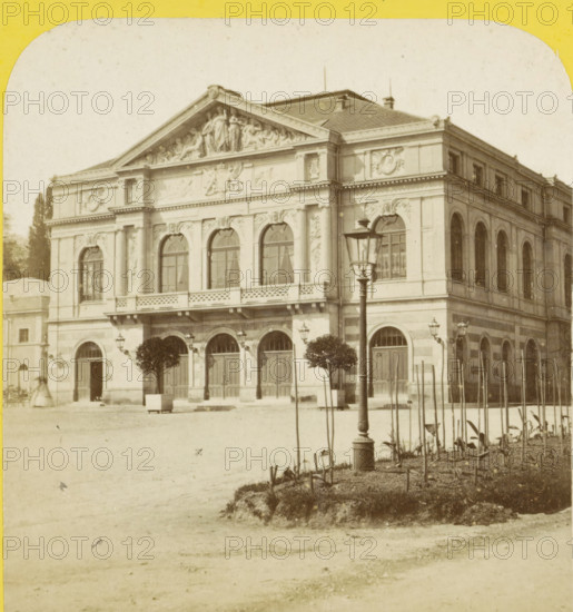 Theater in Baden-Baden, Germany, Baden-Baden (Grand-Duché de Bade), le théâtre, Allemagne, stereograph, copyright notice: 'Déposé.', number: 'N. 313', photographer: Hippolyte Jouvin, 1860 - 1865, Baden-Württemberg, pasteboard, paper, albumen print, height 86 mm x width 177 mm, square, circus, theater (building), Theater Baden-Baden, A sepia-toned photograph of a large ornate building with a decorative triangular pediment showing sculpted figures above a row of arched windows and doors, the facade featuring carved reliefs, columns, and balustrades; a streetlamp stands in front near a pair of trimmed trees and additional smaller lamps flank the entrance, while a planted bed with slender stakes and low vegetation occupies the foreground and an open sandy plaza fills the lower portion of the image.