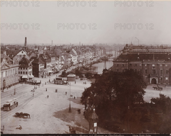 View of the Kongens Nytorv in Copenhagen with the Charlottenborg on the right, Kongens Nytorv with Nyhavn og Charlottenborg, Kjøbenhavn og Omegn, photograph, number: 'Nr. 5.', Copenhagen (city), publisher: Vilhelm Trydes, Denmark, 1880 - 1910, photographer, paper, pasteboard, baryta paper, daylight collodion silver print, height 235 mm x width 283 mm, height 349 mm x width 454 mm, harbour, square, circus, Kongens Nytorv, Charlottenborg, A wide city square opens into a quay lined with tall narrow buildings and docked sailing vessels, with a broad cobblestone open area in the foreground where people walk and stand, horse-drawn carriages and a streetcar move along visible tracks, and lamp posts dot the plaza; to the right a large ornate building with multiple windows and a tree-filled area in front partially obscures the view toward the waterfront, while the long row of gabled and pitched-roof houses along the canal extends into the distance under a light sky.