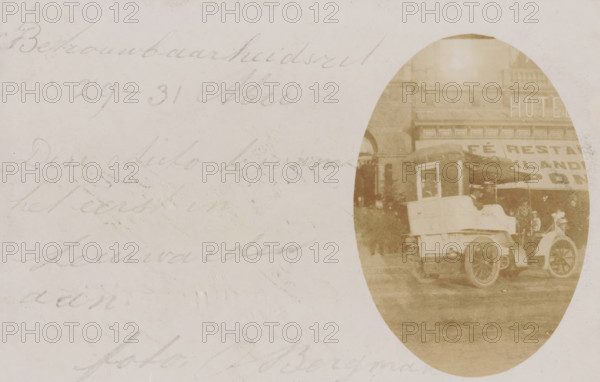 Arrival of the first car in Leeuwarden after a car race from May 29 to 31, photograph, postcard, address: 'To the Honourable Mr. O. Bergman, p. a. Mrs. Widow Verhoeff, Arnhem, Graaf Ottoplein, 17', inscription: 'Reliability run, May 29-31, This car arrived first in Leeuwarden., photo. O. Bergman', photographer: O. Bergman, Leeuwarden, c. 1895 - 1905, paper, baryta paper, pencil, daylight gelatin silver print, height 89 mm x width 139 mm, chariot, triumphal car, A faded oval sepia photograph on the right side of the image shows an early motor vehicle parked on a street in front of a building with a large awning and a sign on the facade; the vehicle has a rounded front, visible wheel spokes, a boxy passenger compartment, and a canopy over the rear seating area, with a person seated inside under the canopy and another figure crouched nearby; the left and central portions of the image show a pale, textured background with faint cursive pencil writing across it.