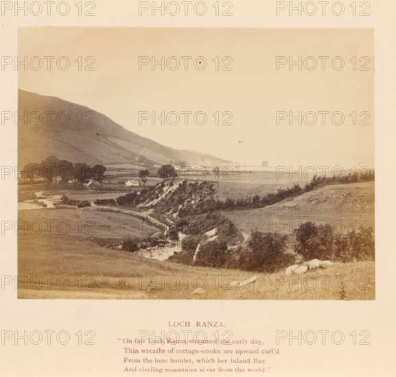 Loch Ranza, Lochranza on Arran in the west of Scotland, photograph, page, inscription: ''On fair, the world.'', photographer: William Russell Sedgfield, Arran, c. 1861 - in or before 1871, paper, albumen print, height 85 mm x width 112 mm, landscapes, island, lake, Lochranza, A sepia-toned landscape photograph shows rolling fields and grassy slopes leading to a shoreline, with a winding stream or river running through the foreground and a stone wall or embankment following the watercourse; a cluster of trees and scattered bushes sit near small white cottages at the foot of a steep hillside on the left, the hillside rising with terraced or ridged textures; in the distance along the coast a low-lying landform and a solitary rectangular structure are faintly visible against a pale sky, while the foreground contains scattered rocks and grassy patches.