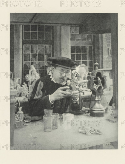 Man engraving on glass, Le Graveur sur fout, photomechanical print, photographer: Henri Colon, cliché maker: Fillon & Heuse, printer (person): Charles Wittmann, Paris, c. 1891 - in or before 1896, printer (person), paper, photoaquatint, height 179 mm x width 141 mm, handicrafts, glass, An older man wearing a dark beret and a dark garment with a light ruffled collar sits at a workbench, holding a small rounded object in his gloved hands and peering at it through round spectacles; behind him are window panes and shelves holding sculpted busts and other objects, while on the bench in front of him are glass containers, a cloth, a tall metal device with a crank and pulley, and various small tools and bottles.