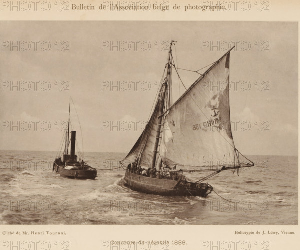 Seascape with sailing ship and tugboat, page, photomechanical print, inscription: 'Concours de négatifs 1888., Médaille de Vermeil.', photographer: Henri Tournai, cliché maker: Josef Löwy, Vienna, c. 1883 - in or before 1888, printer (person), Lower Austria, paper, pasteboard, heliotype, height 115 mm x width 168 mm, Print on unnumbered page., sailing-ship, sailing-boat, sea (seascape), tug, pusher tug, A sepia-toned photograph showing two boats on a choppy sea, one closer with a large triangular sail raised and visible rigging, the hull rounded and crew members aboard, and another boat behind with a vertical smokestack and mast; the sky above is mostly clear with subtle cloud texture and the water shows waves and wake around the vessels.