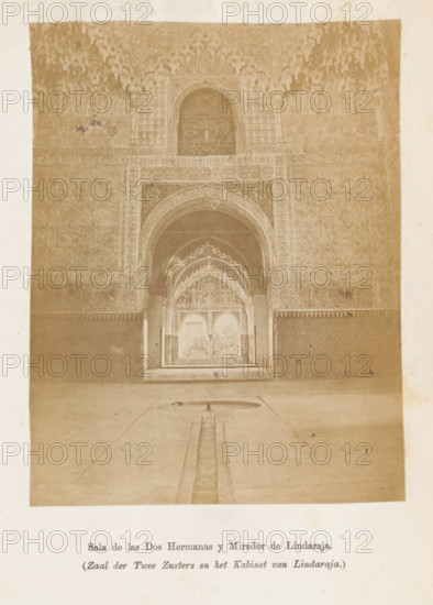Sala de las Dos Harmanas y Mirador de Lindaraja, Zaal der Twee Zusters en het Kabinet van Lindaraja, Patio van Lindaraja gezien door de Zaal der Twee Zusters in het Alhambra, photograph, page, Granada, c. 1875 - in or before 1880, photographer, Andalusia, paper, albumen print, height 128 mm x width 99 mm, interior, representation of a building, Alhambra, A sepia-toned photograph of an ornate interior showing a large arched doorway with layered horseshoe and scalloped arches leading into a smaller archway and a recessed alcove, all richly decorated with geometric and floral carved plasterwork and repeating patterns; a narrow channel runs along a tiled floor toward the doorway, ending in a shallow basin, and the walls flanking the arches display dense patterned panels and decorative friezes, with a vaulted muqarnas-like ceiling above the central arch.