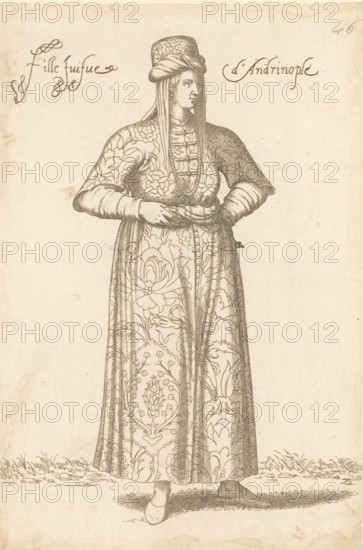 Jewish girl from Andrinople or Edirne in Thrace, Fille juifve d'Andrinople, print, album page, book illustration, Print is part of an album., printmaker: Léon Davet, after drawing by Luca Penni (attributed to), after drawing by Nicolas de Nicolay (possibly), publisher: Guillaume Rouille (I), Lyon, 1555 - 1568, Léon Davent, Luca Penni, Nicolas de Nicolay, Guillaume Rouille (I), printmaker, publisher, Attributed to, paper, etching, pasted on album page, height 260 mm x width 174 mm, A standing figure in a long patterned robe with floral and ornamental designs, wearing a tall headdress with draped fabric and a fitted, buttoned bodice, hands clasped at the waist, long sleeves with fitted cuffs, visible shoes peeking from beneath the hem, finely hatched shading and crosshatching throughout the garment and background, simple ground with short grass and shadowing beneath the figure.