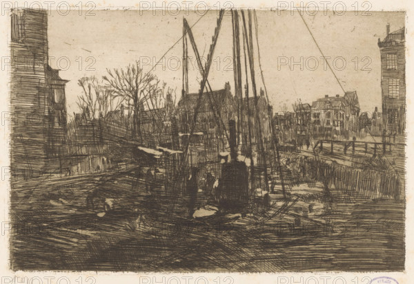 Pile driving in the Raadhuisstraat in Amsterdam, print, The construction pit of the shopping arcade in the Amsterdam Raadhuisstraat., workshop stamp: 'Atelier GH Breitner', printmaker: George Hendrik Breitner, c. 1898, paper, etching, intaglio printmaking technique, height 199 mm x width 297 mm, building-site, city-view, and landscape with man-made constructions, Amsterdam, Raadhuisstraat, A monochrome etching shows a waterside scene with tall, narrow masts rising near the center, silhouetted against a pale sky, and rigging lines angling outward. Along the horizon are densely sketched buildings with pitched roofs and rows of windows, flanked by taller multi-story facades at the left and right edges. Bare trees with intricate, branching twigs stand among the structures. In the foreground a dark, heavily hatched area suggests a shoreline or quay with scattered irregular light patches and linear textures. A low railing runs along a path on the right, and vertical posts and beams punctuate...