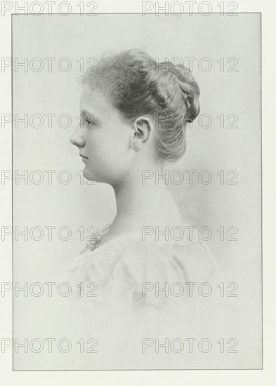 Portrait of Wilhelmina, Queen of the Netherlands, photomechanical print, Portrait of Wilhelmina. In the lower margin her name and title., photographer: Adolphe Zimmermans, cliché maker: anonymous, Netherlands, publisher: Maarten van der Beek, The Hague, 1898, paper, autotype, height 505 mm x width 355 mm, The title mentioned here refers to the highest title obtained by the sitter, not necessarily to the title the sitter bears in this image., Person, Wilhelmina of the Netherlands, A grayscale portrait of a young person shown in profile facing left, with hair pulled back into a smooth bun and short curly bangs at the forehead, a visible ear, a straight nose, closed lips, and a long neck; the subject wears a light, textured garment with soft folds and the background is plain and softly shaded.