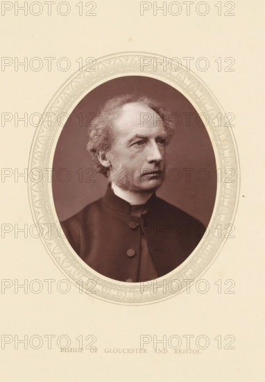 Bishop of Gloucester and Bristol, page, photomechanical print, photographer: Lock & Whitfield, cliché maker: anonymous, c. 1871 - in or before 1876, paper, Woodburytype, height 115 mm x width 89 mm, Person, Charles Ellicott, functionaries and dignitaries, episcopal Protestant churches, historical persons (portraits and scenes from the life) ((full) bust portrait), A sepia-toned oval portrait of an older man set against a decorative oval border on a light background, showing his head and upper torso turned slightly to one side with thinning, wavy hair and prominent sideburns, a high forehead, visible facial lines, and a composed expression; he wears a dark buttoned garment with a narrow white collar and the textured inner oval around him contrasts with the smooth outer background.