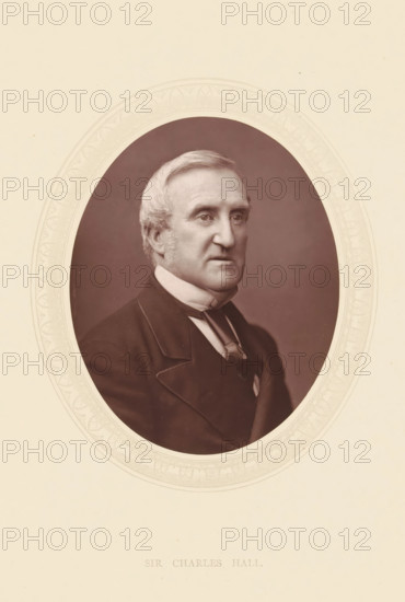 Sir Charles Hall, page, photomechanical print, photographer: Lock & Whitfield, cliché maker: anonymous, c. 1871 - in or before 1876, paper, Woodburytype, height 115 mm x width 89 mm, Person, Charles Hall, lawyer, attorney at law, historical persons (portraits and scenes from the life) ((full) bust portrait), An oval sepia portrait centered on a cream background shows an older man with light hair combed to the side and short sideburns, wearing a dark formal coat with wide lapels, a high white collar, and a tied cravat, his expression neutral and his gaze directed slightly to the viewer's left, framed by a decorative embossed oval border against the plain paper.