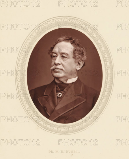 Dr. WH Russell, page, photomechanical print, photographer: Lock & Whitfield, cliché maker: anonymous, c. 1871 - in or before 1876, paper, Woodburytype, Woodbury Process, height 115 mm x width 89 mm, Person, William Howard Russell, journalist, reporter, historical persons (portraits and scenes from the life) ((full) bust portrait), A sepia portrait of an older man shown from the chest up inside an ornate oval frame with decorative leaf and scroll patterns, the man has wavy hair, bushy sideburns and a mustache, a high white collar is visible above a dark coat with wide lapels and a tied neckcloth, the background inside the oval is a plain dark tone and the outer area is a light cream paper.