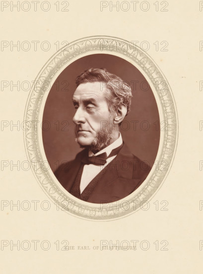 The earl of Shaftesbury, page, photomechanical print, photographer: Lock & Whitfield, cliché maker: anonymous, c. 1871 - in or before 1876, paper, Woodburytype, Woodbury Process, height 115 mm x width 89 mm, Person, Anthony Ashley Cooper, politician, eg party leader, historical persons (portraits and scenes from the life) ((full) bust portrait), An oval sepia portrait of an older man shown in three-quarter profile facing left, with neatly combed hair and prominent sideburns, wearing a dark suit jacket, waistcoat, white shirt, and bow tie, set against a dark background and surrounded by an ornate decorative oval frame on a light textured paper.