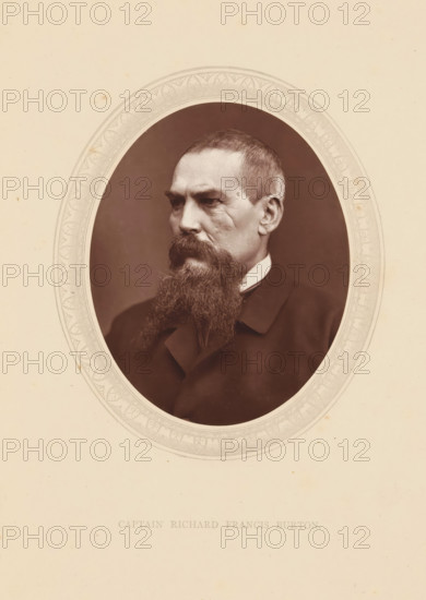 Captain Richard Francis Burton, page, photomechanical print, photographer: Lock & Whitfield, cliché maker: anonymous, c. 1871 - in or before 1876, paper, Woodburytype, height 115 mm x width 89 mm, Person, Richard Francis Burton, explorer, historical persons (portraits and scenes from the life) ((full) bust portrait), A sepia-toned oval portrait of a man with short hair and a long full beard, shown from the shoulders up and turned slightly to his left, wearing a dark coat and a high white collar, set against a dark background and surrounded by a pale ornate oval mat on a light paper.