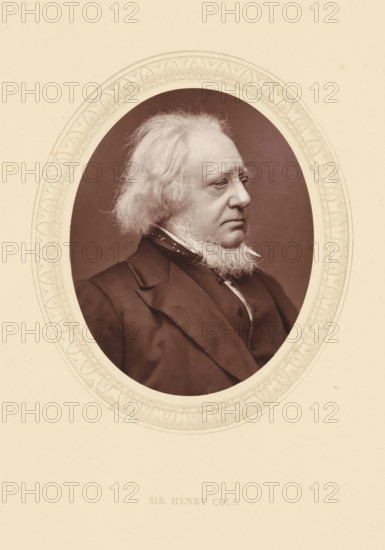 Sir Henry Cole, page, photomechanical print, photographer: Lock & Whitfield, cliché maker: anonymous, c. 1871 - in or before 1876, paper, Woodburytype, Woodbury Process, height 115 mm x width 89 mm, Person, Henry Cole, magistracy, judges, historical persons (portraits and scenes from the life) ((full) bust portrait), An oval portrait of an older man shown in profile facing right, with light-colored wavy hair and a full beard along his jawline, wearing a dark suit jacket, waistcoat, high-collared shirt, and a patterned neck scarf, set against a plain darker background and framed by an ornate decorative oval border on a light-colored mounting.