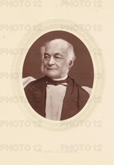 The bishop of Salisbury, page, photomechanical print, photographer: Lock & Whitfield, cliché maker: anonymous, c. 1871 - in or before 1876, paper, Woodburytype, Woodbury Process, height 115 mm x width 89 mm, Person, George Moberly, archbishop, bishop, etc. (Roman Catholic), historical persons (portraits and scenes from the life) ((full) bust portrait), A framed oval portrait of an older man shown from the chest up, with light hair and prominent sideburns, wearing a dark robe over a light garment and a bow at the collar; the oval is set against a pale background with a decorative border around the portrait.