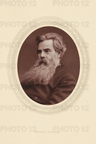 Thomas Woolner, page, photomechanical print, photographer: Lock & Whitfield, cliché maker: anonymous, c. 1871 - in or before 1876, paper, Woodburytype, Woodbury Process, height 115 mm x width 89 mm, Person, portrait, self-portrait of sculptor, historical persons (portraits and scenes from the life) ((full) bust portrait), A sepia portrait of a man shown from the chest up inside an ornate oval frame, with a full, long, bushy beard and thick wavy hair swept back, wearing a dark double-breasted coat, his face turned slightly to one side and his expression neutral, set against a plain dark background and mounted on a light-colored sheet with decorative border around the oval.