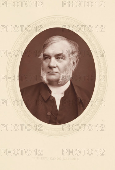 The rev. Canon Gregory, page, photomechanical print, photographer: Lock & Whitfield, cliché maker: anonymous, c. 1871 - in or before 1876, paper, Woodburytype, Woodbury Process, height 115 mm x width 89 mm, Person, Robert Gregory, priest (Roman Catholic), historical persons (portraits and scenes from the life) ((full) bust portrait), An oval sepia-toned portrait of a middle-aged man with sideburns set against a darker oval background, framed by an ornate pale border on a light background; he wears a dark coat with visible buttons and a high white collar, his hair is swept to the side, and his expression is neutral with eyes looking slightly to one side.